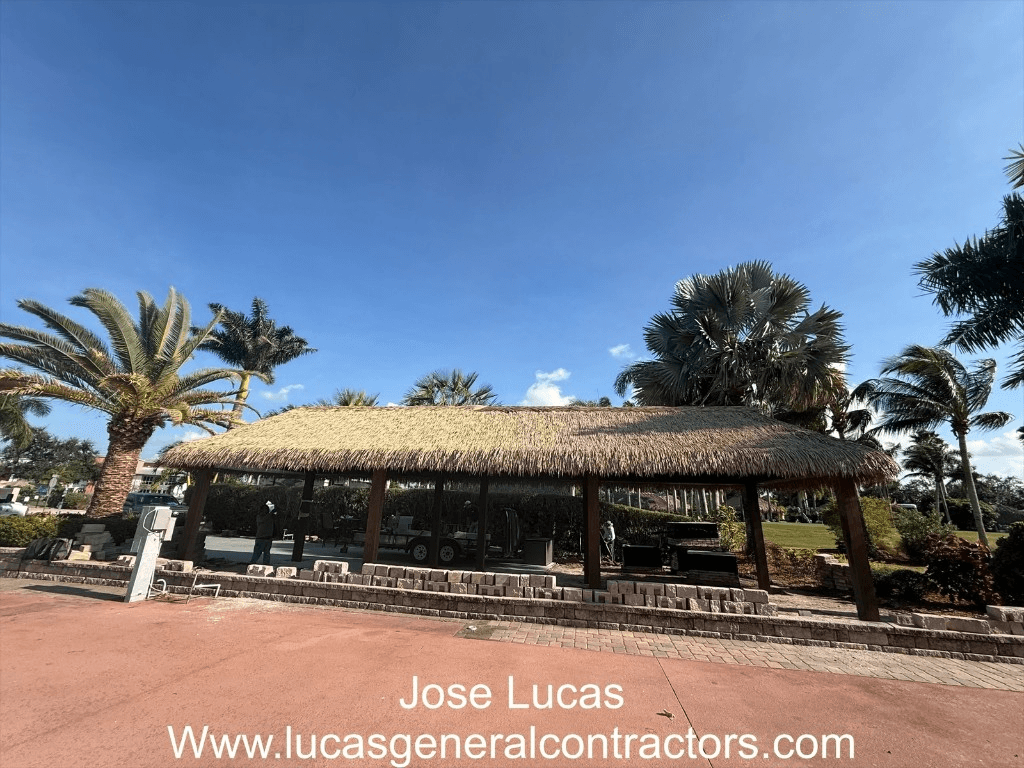 Thatched pavilion with palm trees, Lucas General Contractors